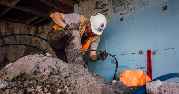 WJ Middle East 1 Worker checking pipes on construction site