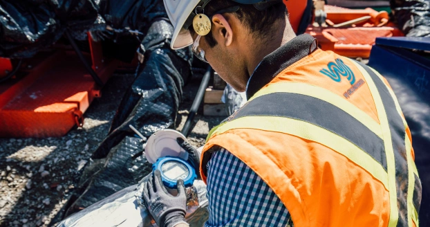 WJ Middle East 2 Worker checking reading meter on site