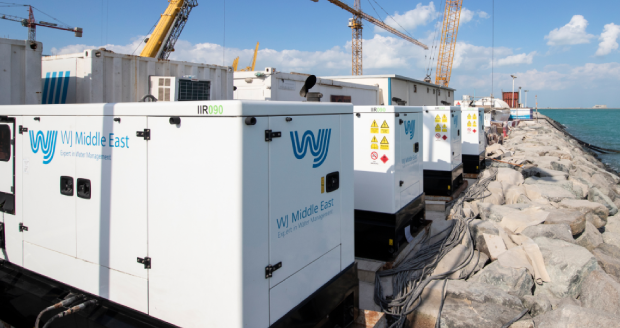 Portable power generators at a construction site along the coast for WJ Middle East projects.